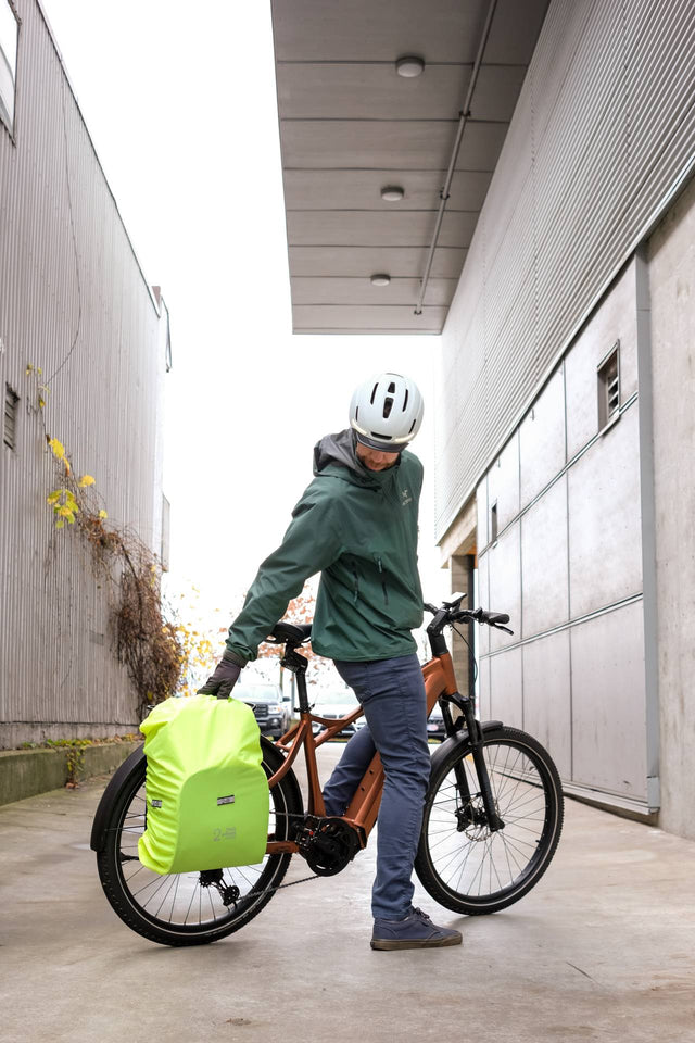 Two Wheel Gear Grey Inverter Pannier Backpack being being carried as pannier attached to bike