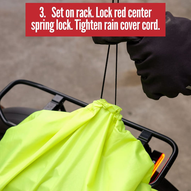 Two Wheel Gear Grey Inverter Pannier Backpack conversion step 3. Set on rack. Lock red center spring lock. Tighten rain cover cord.